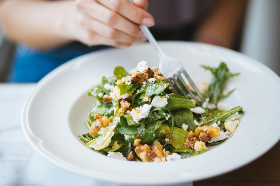 black walnuts added to a salad