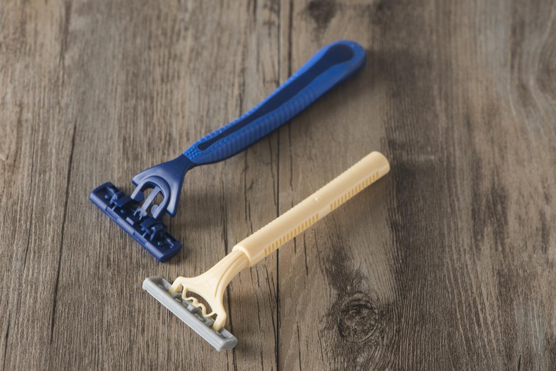 Shaving razors on wooden table