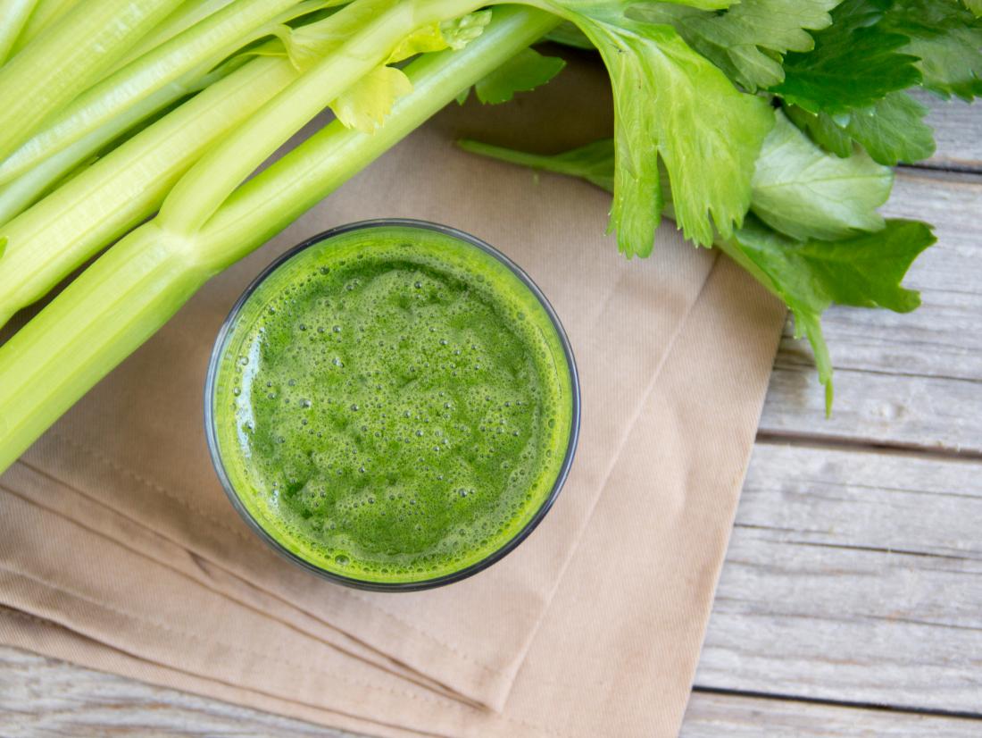 glass of celery juice and stick of celery