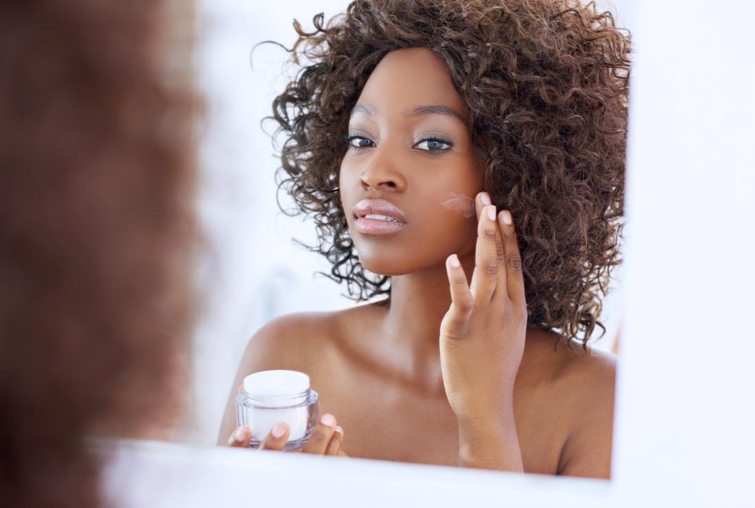 Woman using a moisturizer for dry skin on face