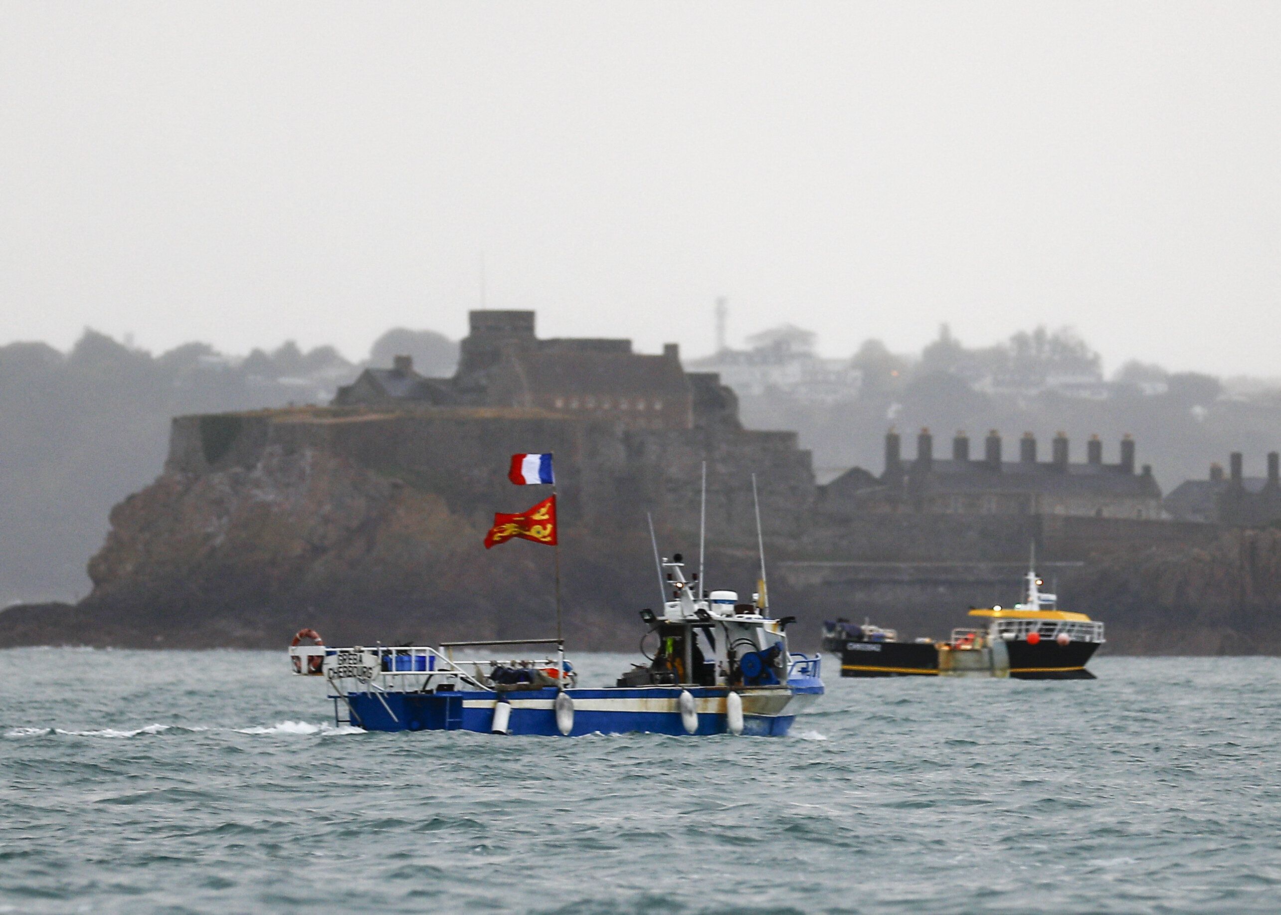 French fishing boats protest in front of the port of St Helier off the island of