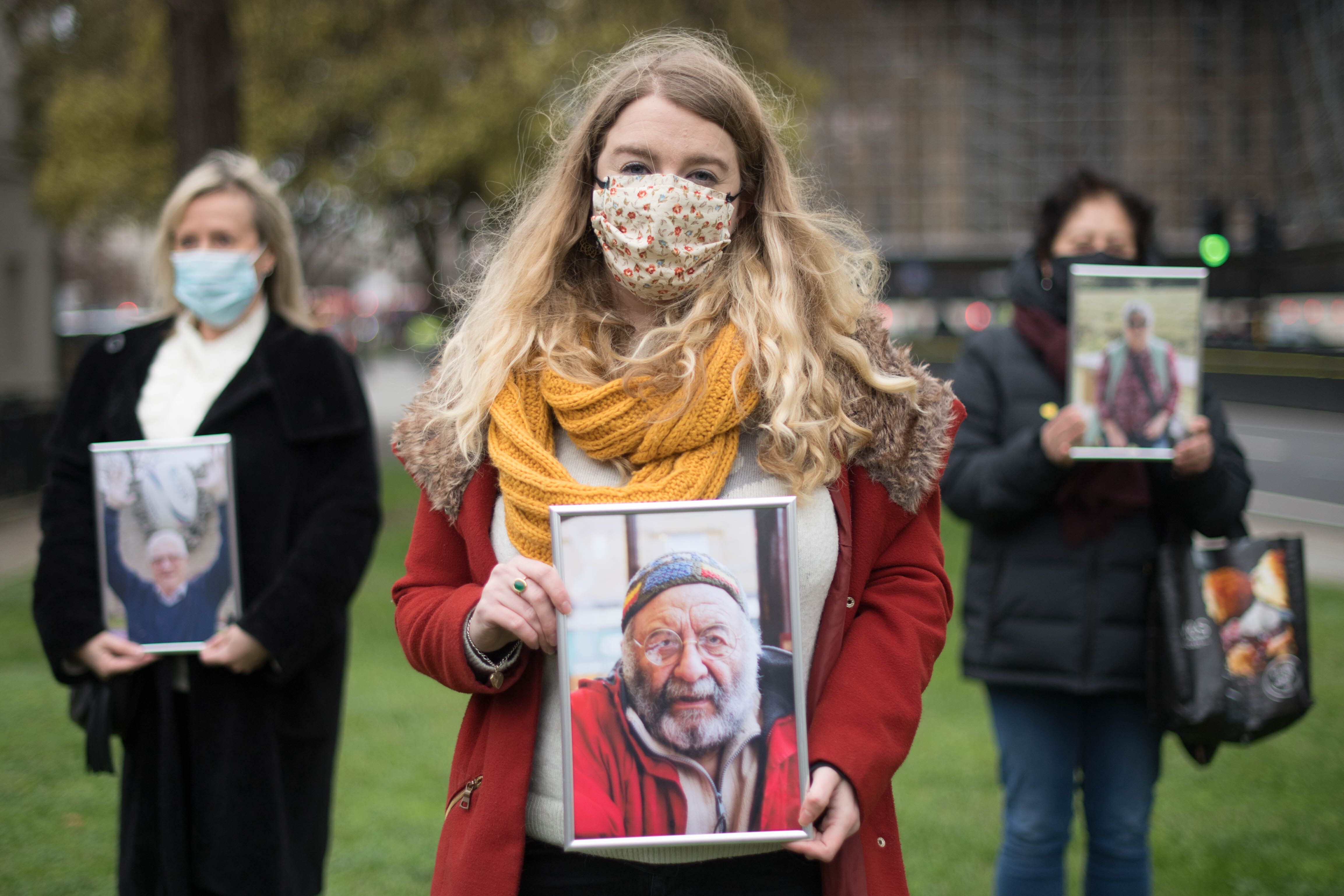 Jo Goodman, who lost her father Stuart, 72, to COVID 19 stands with other families bereaved by the virus...