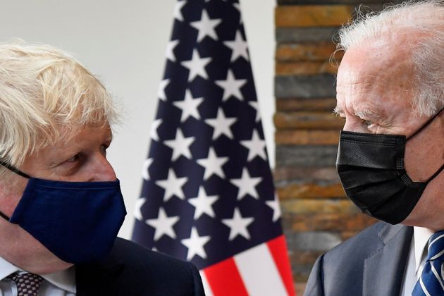 Boris Johnson speaks with US President Joe Biden at the Carbis Bay Hotel,