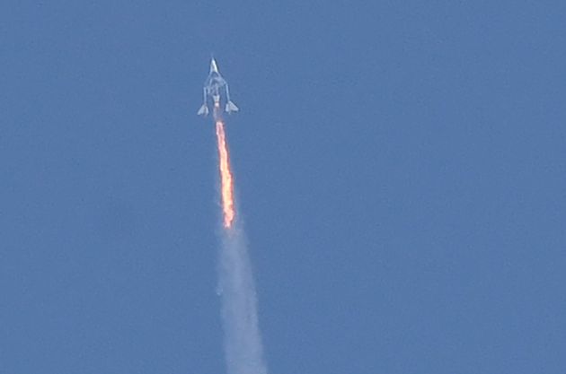 The Virgin Galactic SpaceShipTwo space plane Unity and its mothership separate as they fly above Spaceport...