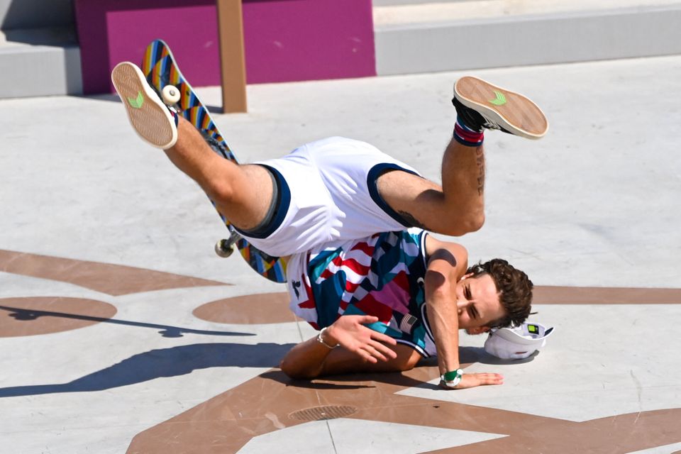 Jagger Eaton of the US takes a fall as he competes in the men's street prelims heat