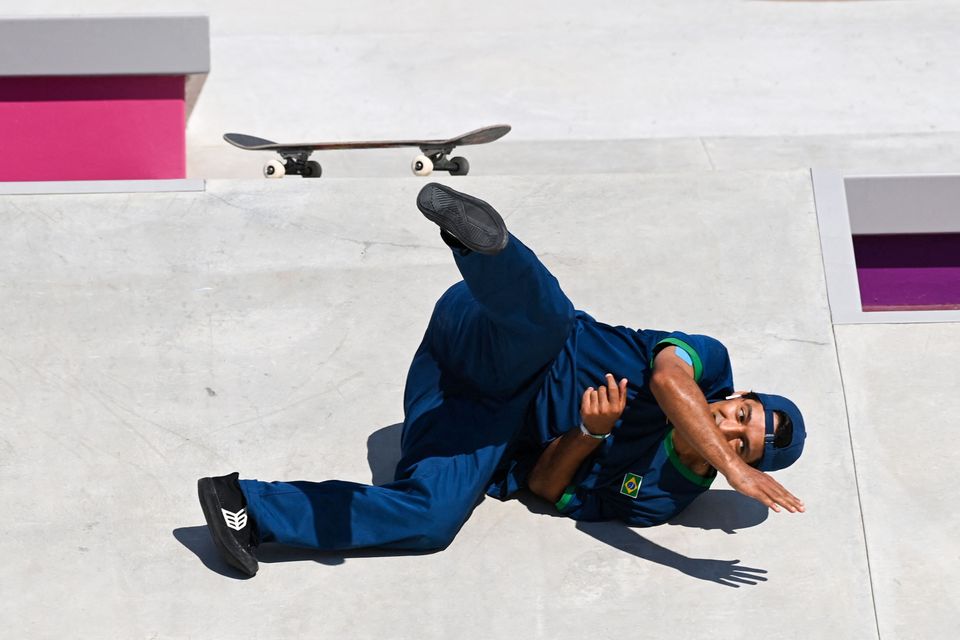 Brazil's Kelvin Hoefler takes a fall as he competes in the men's street prelims heat