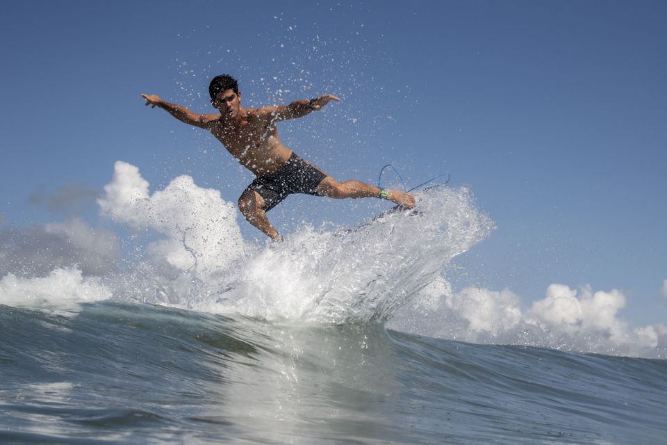 Chile's Manuel Selman rides a wave during a free training