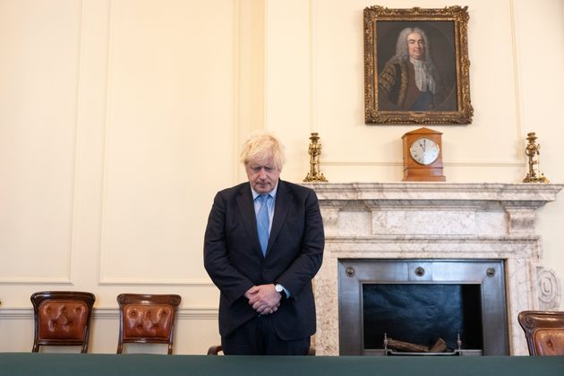 Boris Johnson marking the 11am silence for victims of the Plymouth