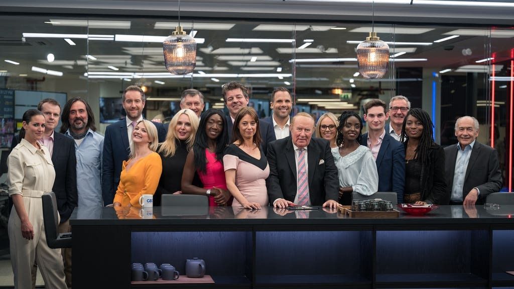 Andrew Neil posing with the on-air GB News team after its launch