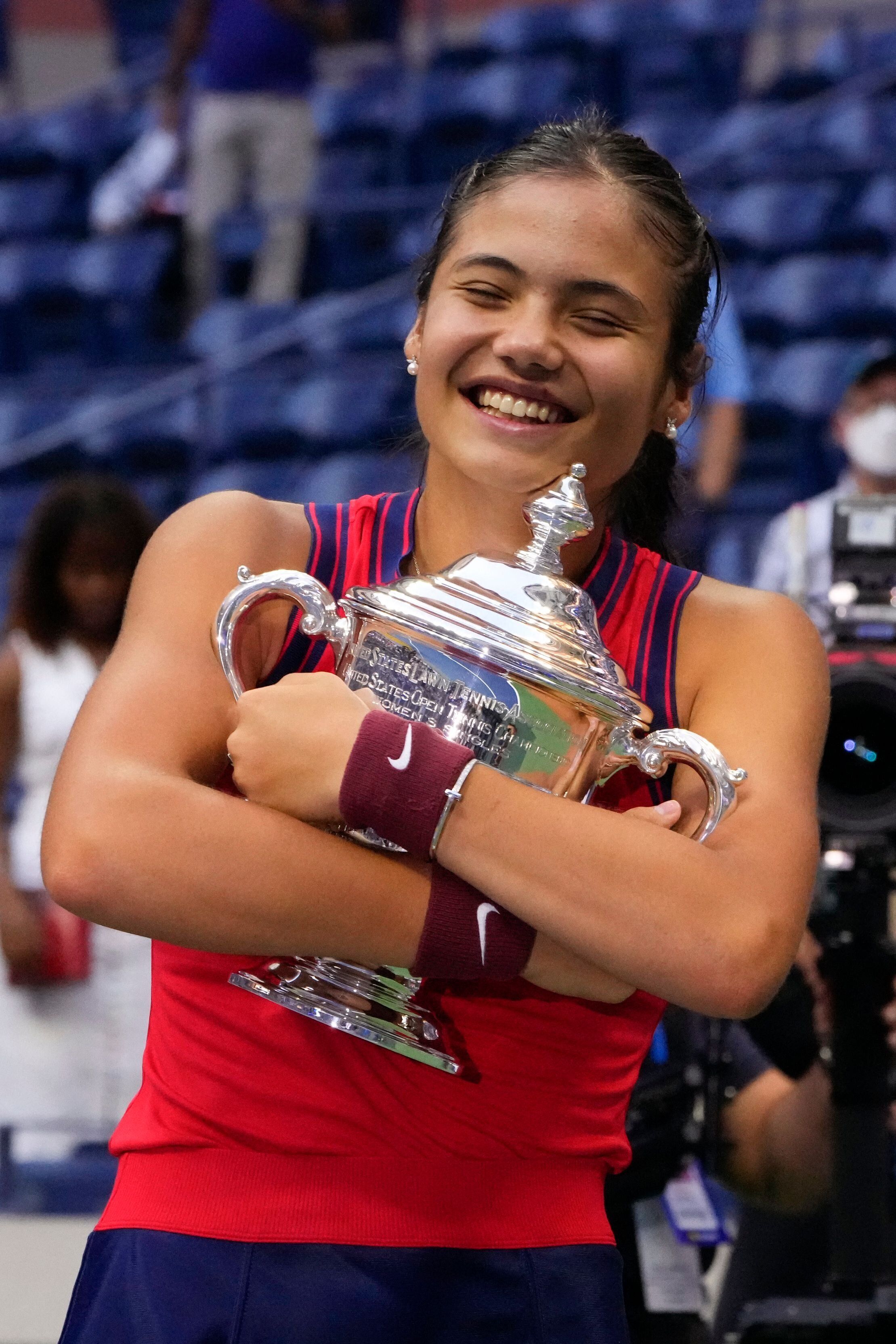 Britain's Emma Raducanu celebrates with the trophy after winning the 2021 US Open Tennis tournament women's...