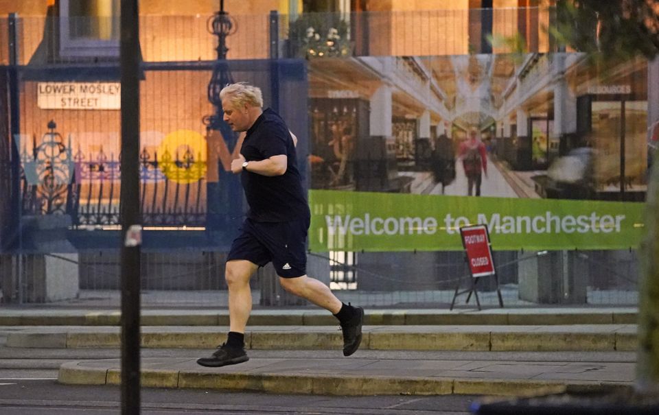 Prime Minister Boris Johnson goes for a run ahead on