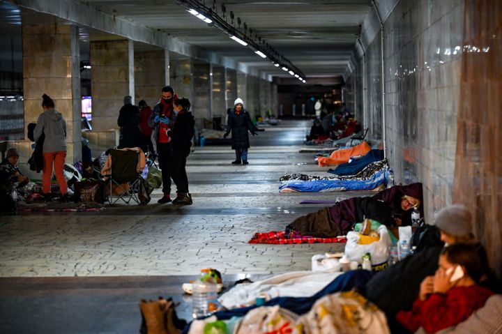 Civilians take shelter at an underground metro station in Kyiv on March 2, 2022