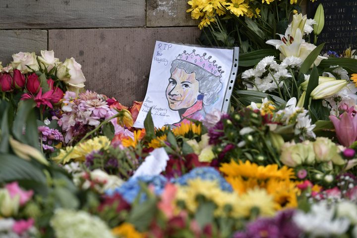 Floral tributes left for the Queen outside Hillsborough Castle during the King's visit.