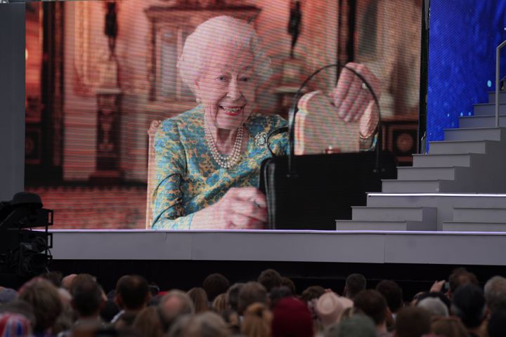 The late Queen having tea with Paddington during the Platinum Party at the Palace.