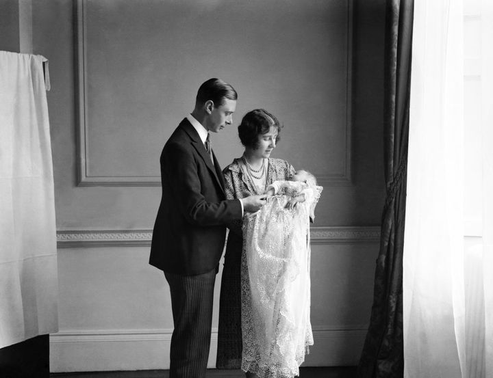 The Queen Mother (then the Duchess of York) with her husband, King George VI (then the Duke of York), and their daughter Elizabeth II at her christening in May 1926