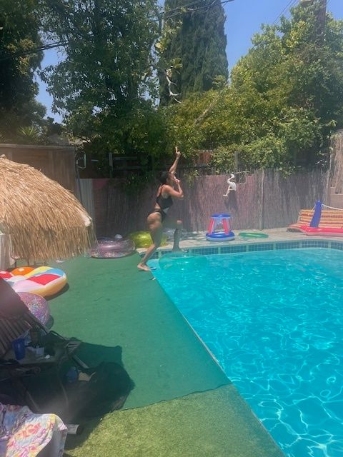 The author at a pool with two friends for the first time in July 2024.