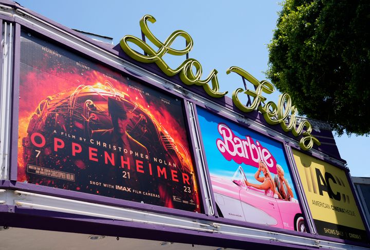 The marquee for the Los Feliz Theatre features the films "Oppenheimer" and "Barbie," Friday, July 28, 2023, in Los Angeles. (AP Photo/Chris Pizzello)