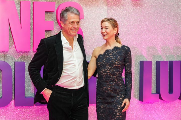 Hugh Grant, left, and Renee Zellweger pose for photographers upon arrival at the screening for the film 'Bridget Jones: Mad About the Boy' 